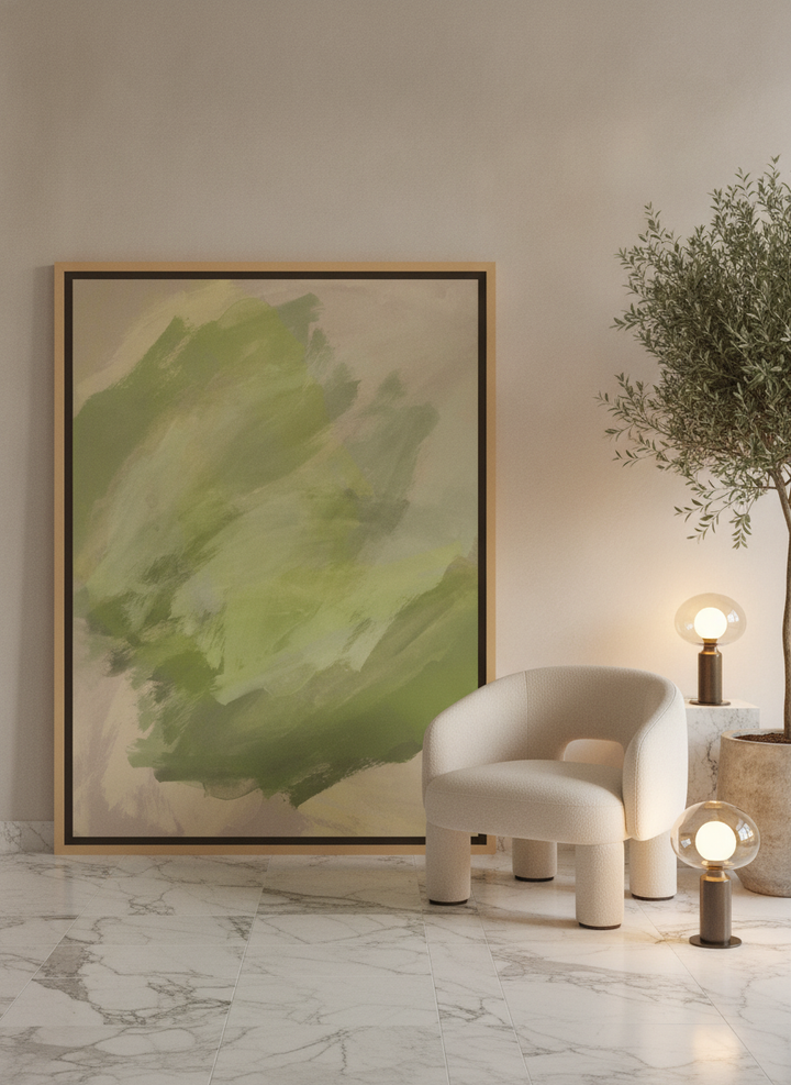 Oversized statement canvas wall art with a natural timber surround leaning against the wall in a luxe living room