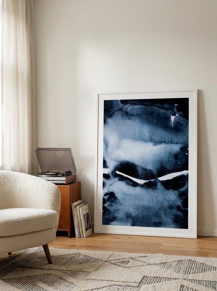 Modern wall art print leaning against the wall in a mid-century bedroom