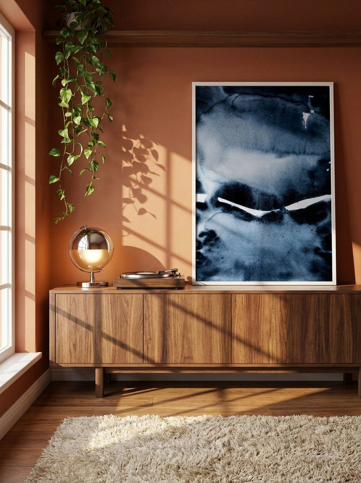 Canvas wall art with a white surround standing on a sideboard in a retro 70s bedroom