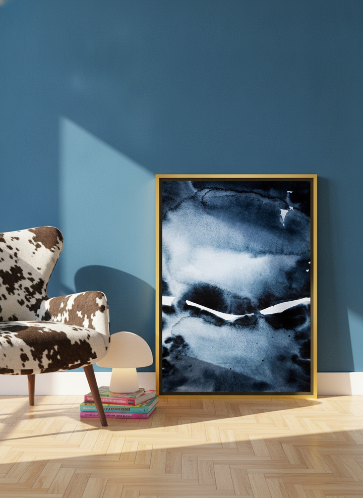 Canvas wall art with a gold leaf surround leaning against the wall in a colourful eclectic home office