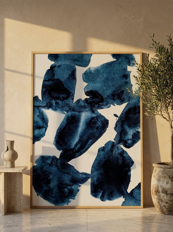 Oversized statement modern wall art print leaning against the wall in a luxe dining room