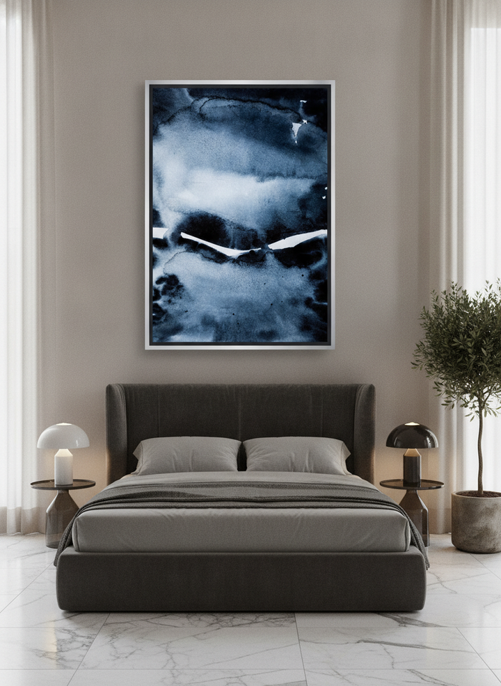 Oversized statement canvas wall art with a silver leaf surround styled on the wall in a luxe bedroom