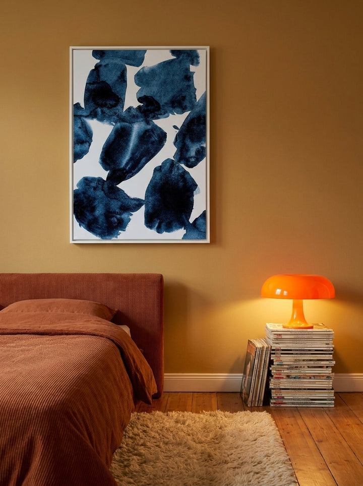 Canvas wall art with a white surround styled on the wall in a retro 70s bedroom