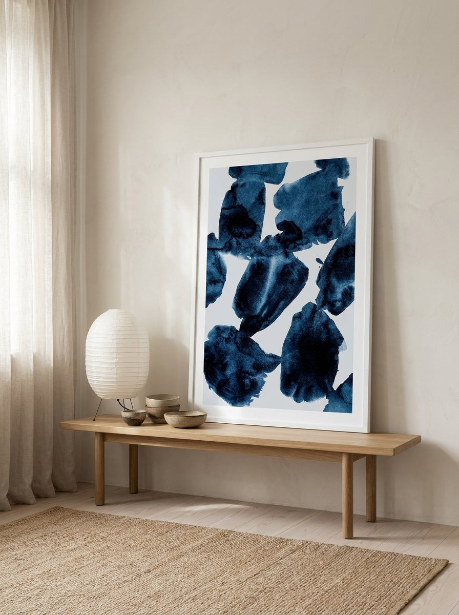 Modern wall art print standing on a bench in a warm Japandi home office