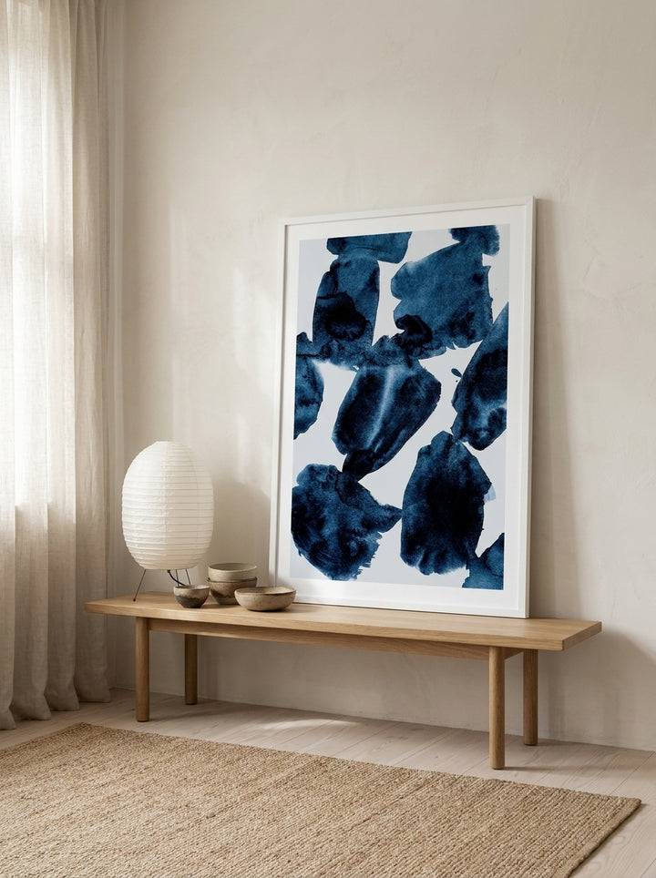 Modern wall art print standing on a bench in a warm Japandi home office