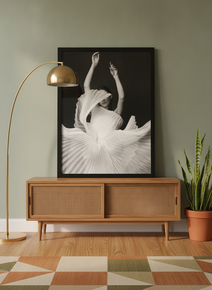 Modern wall art print standing on a sideboard in a mid-century living room