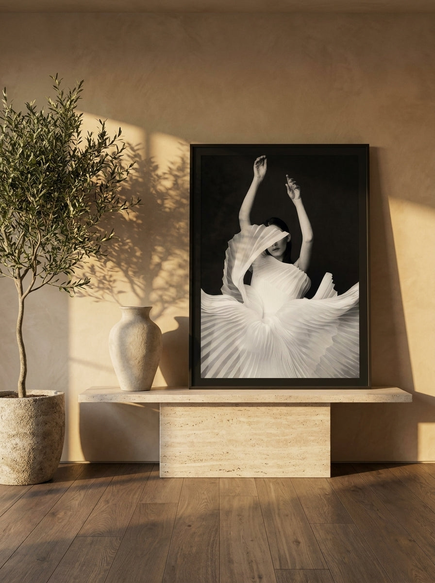 Modern wall art print standing on a console in a luxe bedroom