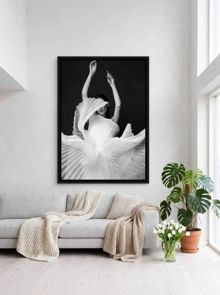 Oversized statement canvas wall art with a black surround styled on the wall in a bright Scandinavian living room