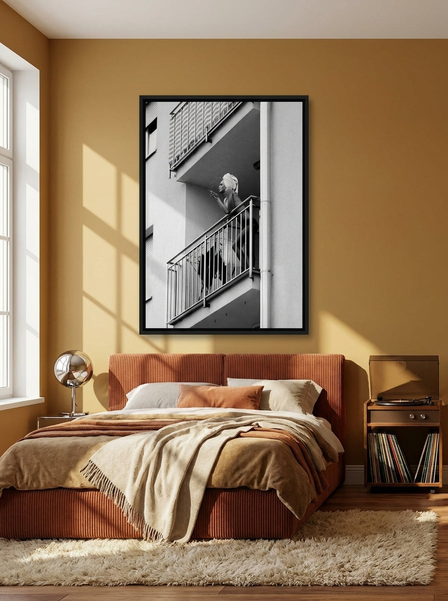 Canvas wall art with a black surround styled on the wall in a retro 70s bedroom