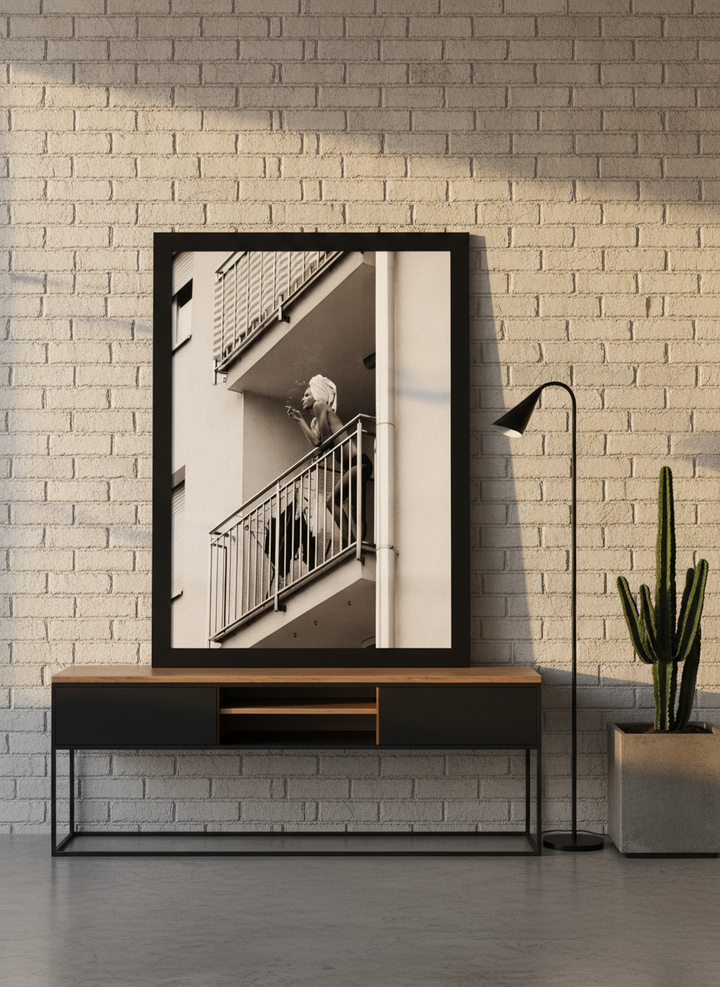 Modern wall art print standing on a console in an industrial loft home office