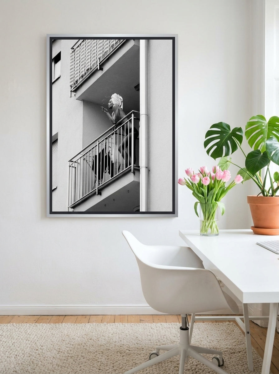 Canvas wall art with a silver leaf surround styled on the wall in a bright Scandinavian home office