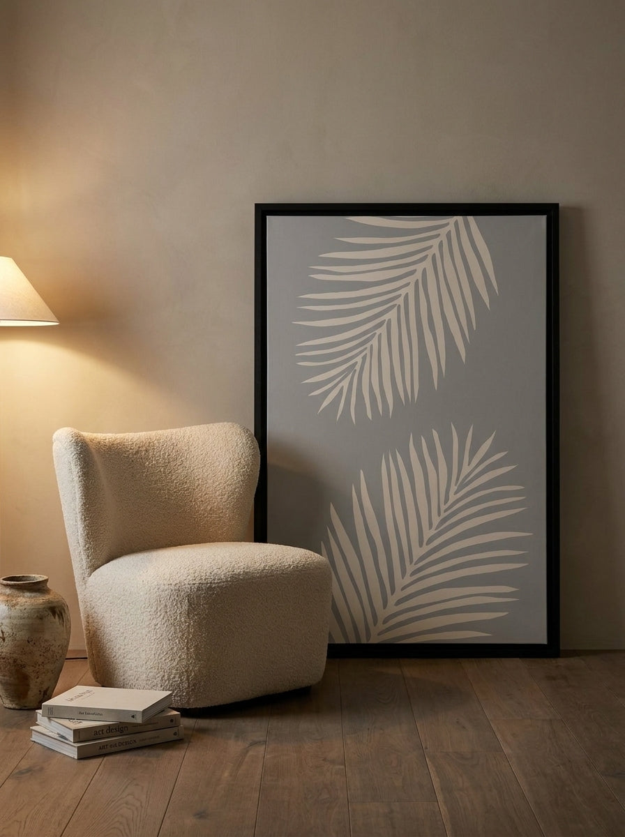 Canvas wall art with a black surround leaning against the wall in a luxe bathroom