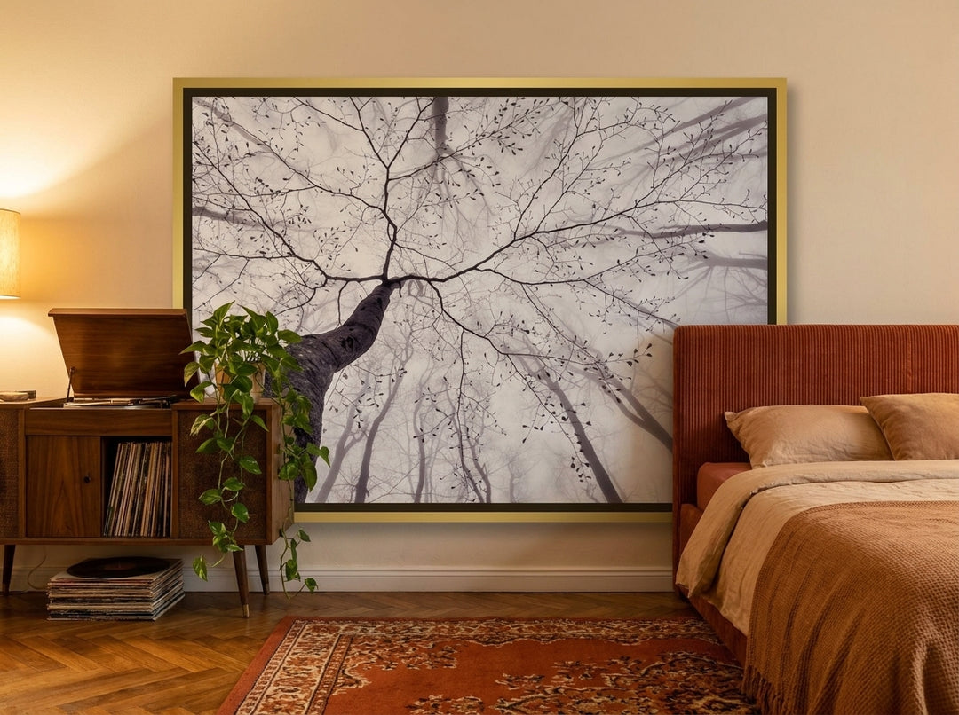 Canvas wall art with a gold leaf surround styled on the wall in a retro 70s bedroom