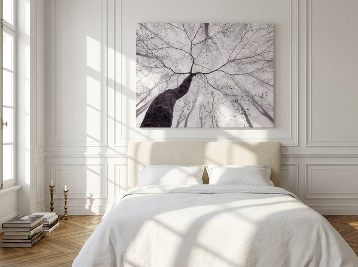 Stretched canvas wall art styled on the wall in a Parisian bedroom