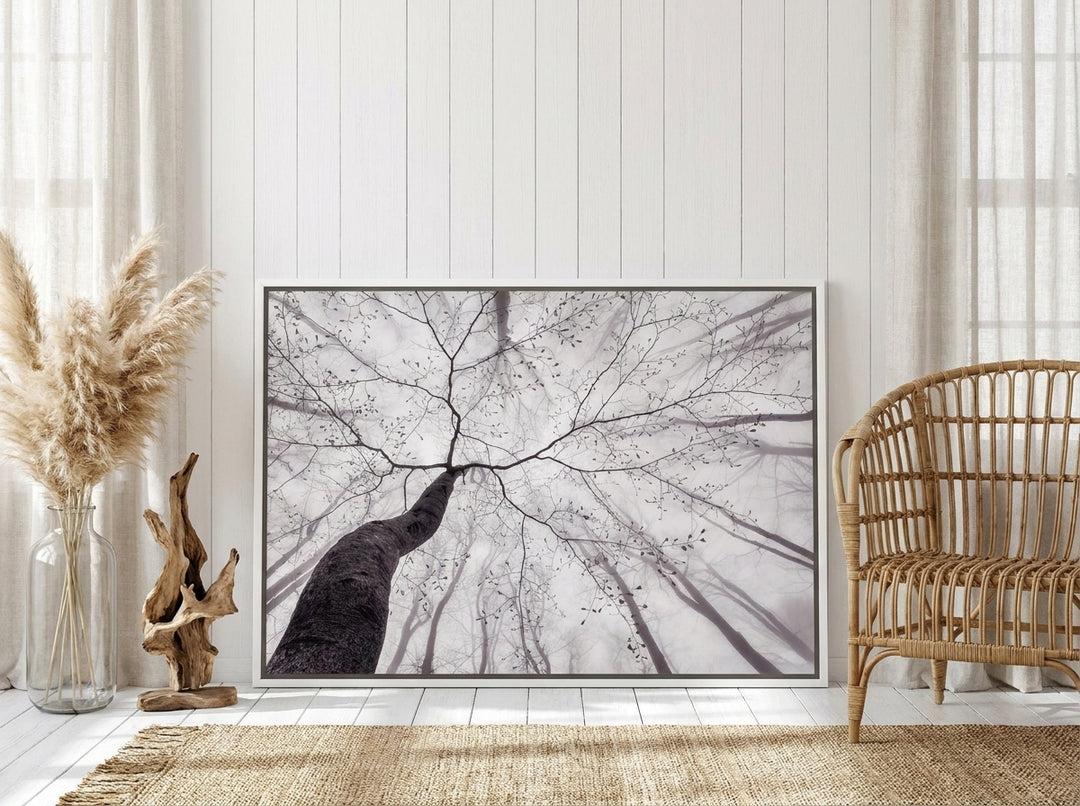 Canvas wall art with a white surround leaning against the wall in a coastal home office
