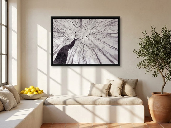 Canvas wall art with a black surround styled on the wall in a Mediterranean living room