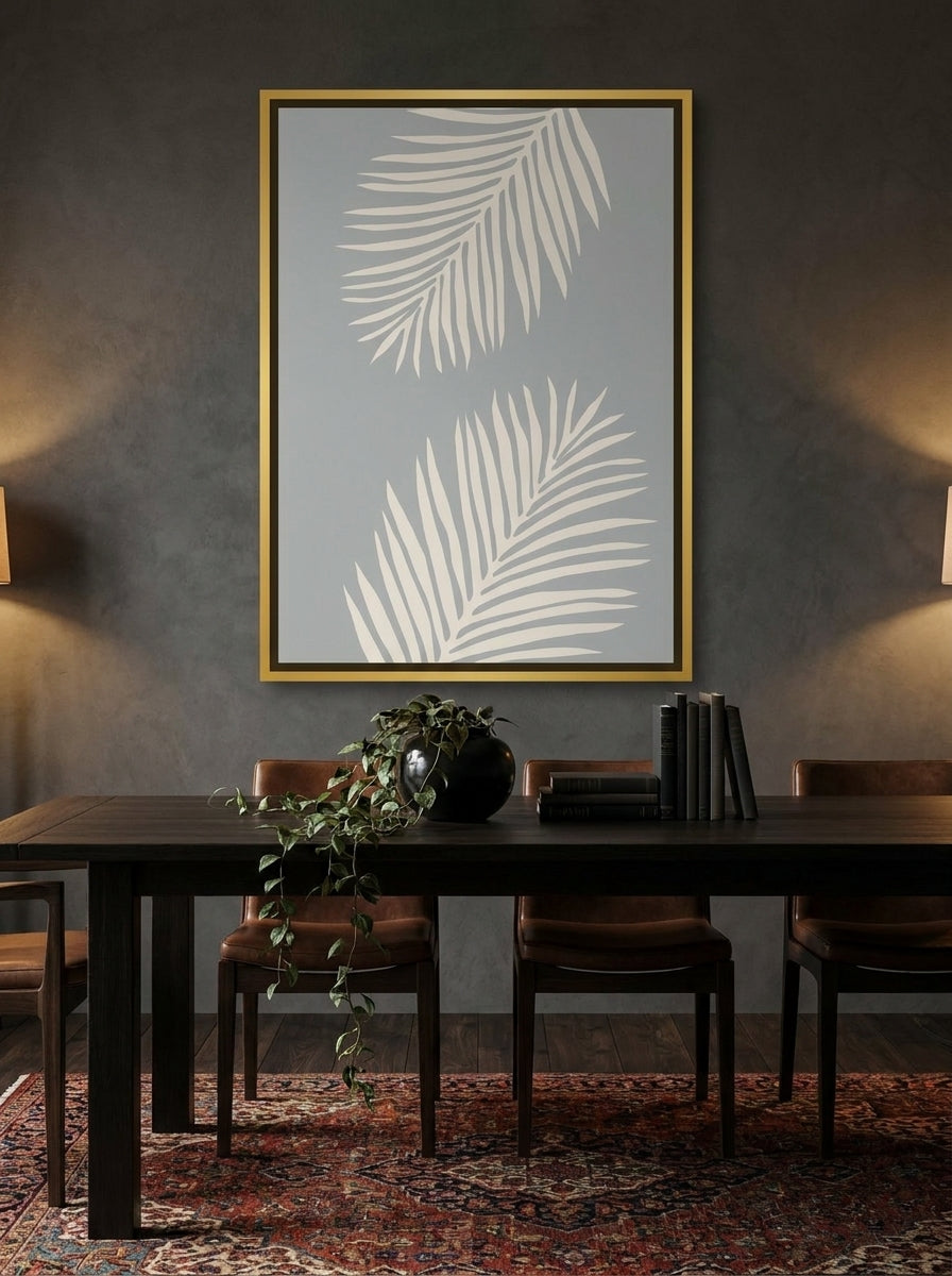 Canvas wall art with a gold leaf surround styled on the wall in a moody dining room
