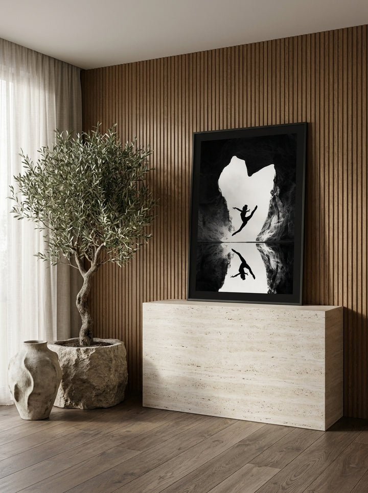 Modern wall art print standing on a console in a luxe home office