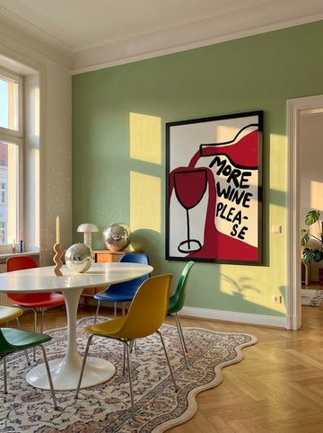 Oversized statement modern wall art print styled on the wall in a colourful eclectic dining room