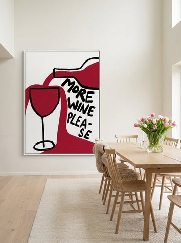 Oversized statement canvas wall art with a white surround styled on the wall in a bright Scandinavian dining room