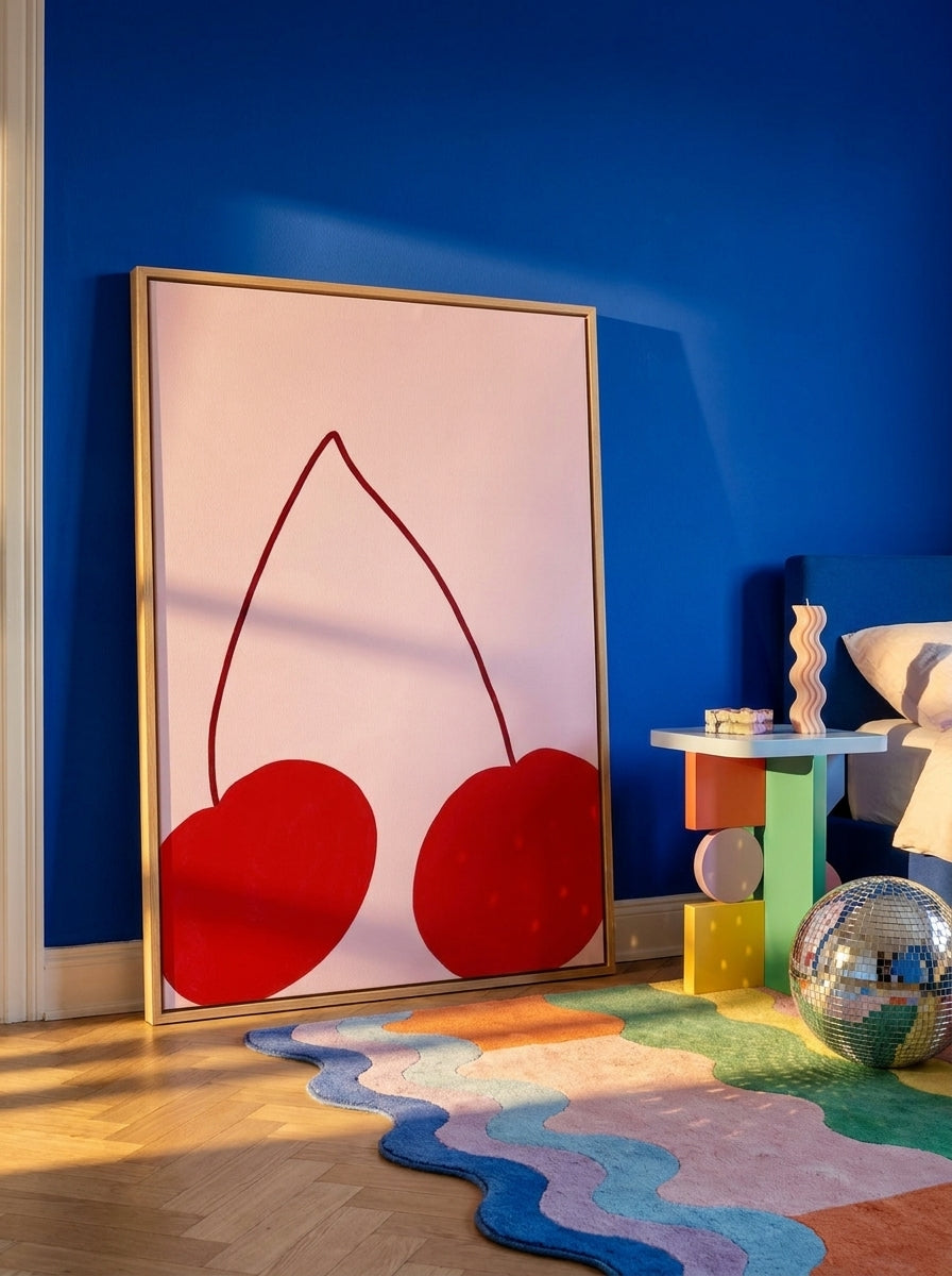 Oversized statement canvas wall art with a natural timber surround leaning against the wall in a colourful eclectic bedroom