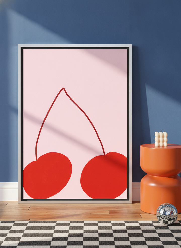 Canvas wall art with a silver leaf surround leaning against the wall in a colourful eclectic bedroom