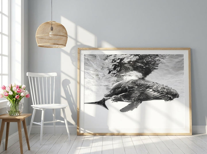 Modern wall art print leaning against the wall in a bright Scandinavian bedroom