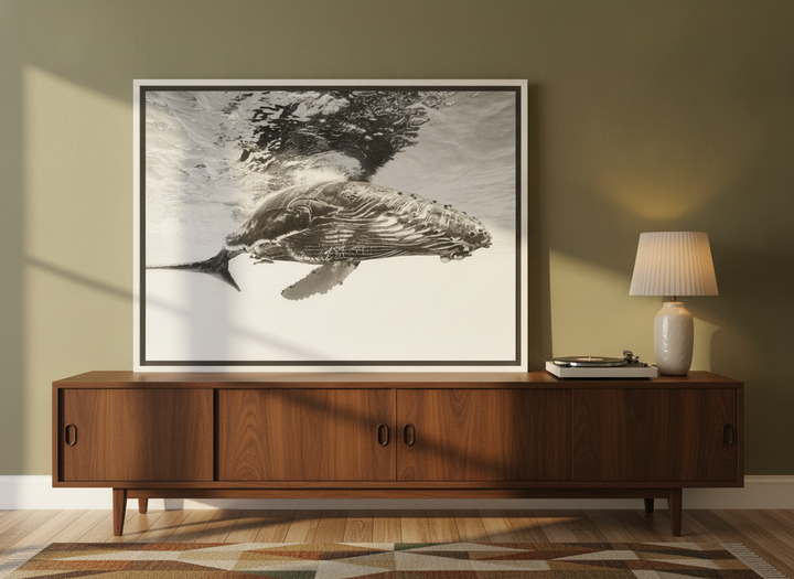 Canvas wall art with a white surround standing on a sideboard in a mid-century home office