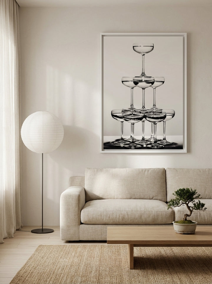 Oversized statement canvas wall art with a white surround styled on the wall in a warm Japandi living room
