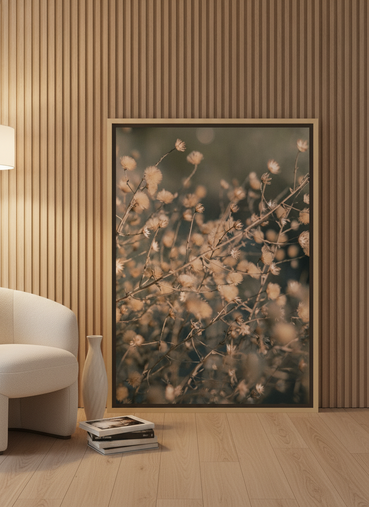 Canvas wall art with a natural timber surround leaning against the wall in a luxe bathroom
