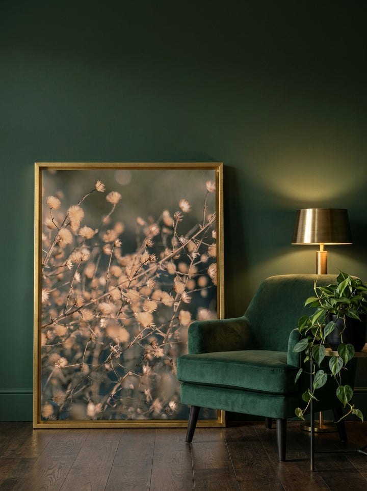 Canvas wall art with a gold leaf surround leaning against the wall in a moody bedroom