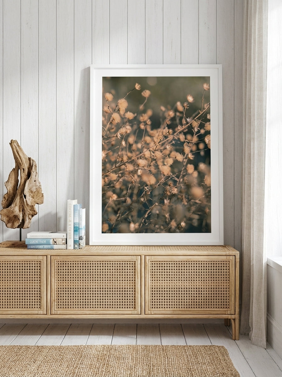 Modern wall art print standing on a sideboard in a coastal bathroom