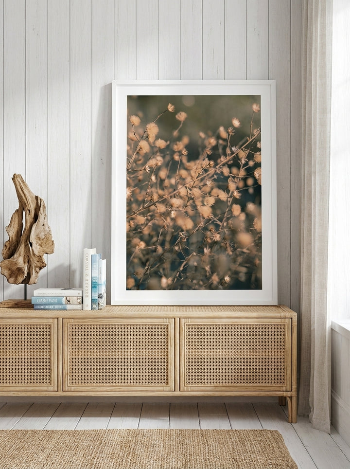 Modern wall art print standing on a sideboard in a coastal bathroom
