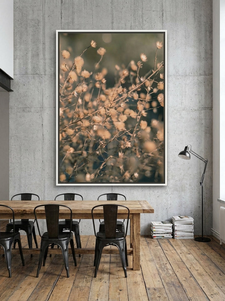 Oversized statement canvas wall art with a white surround styled on the wall in an industrial loft dining room