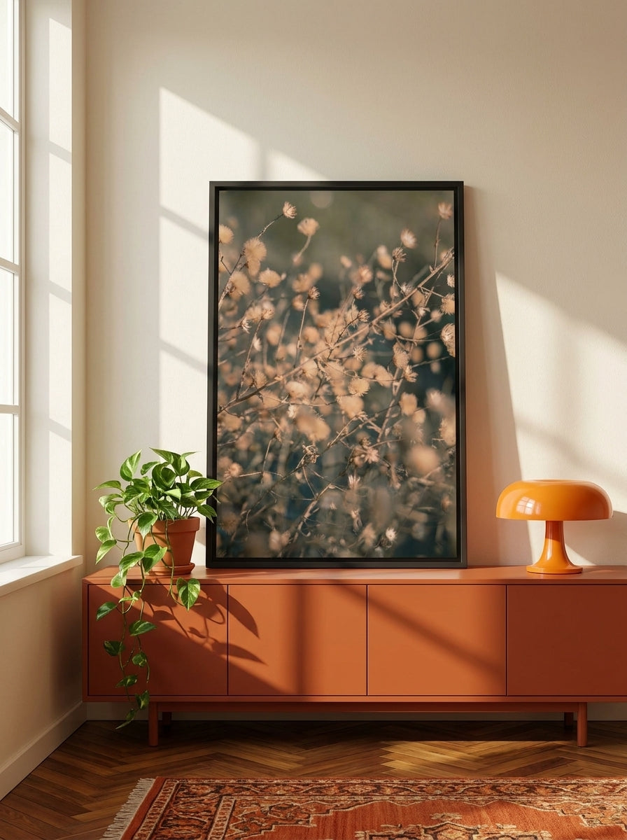 Canvas wall art with a black surround standing on a sideboard in a retro 70s home office