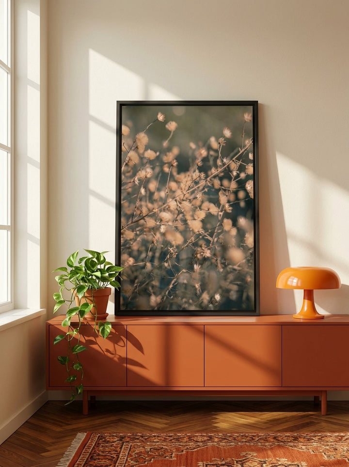 Canvas wall art with a black surround standing on a sideboard in a retro 70s home office