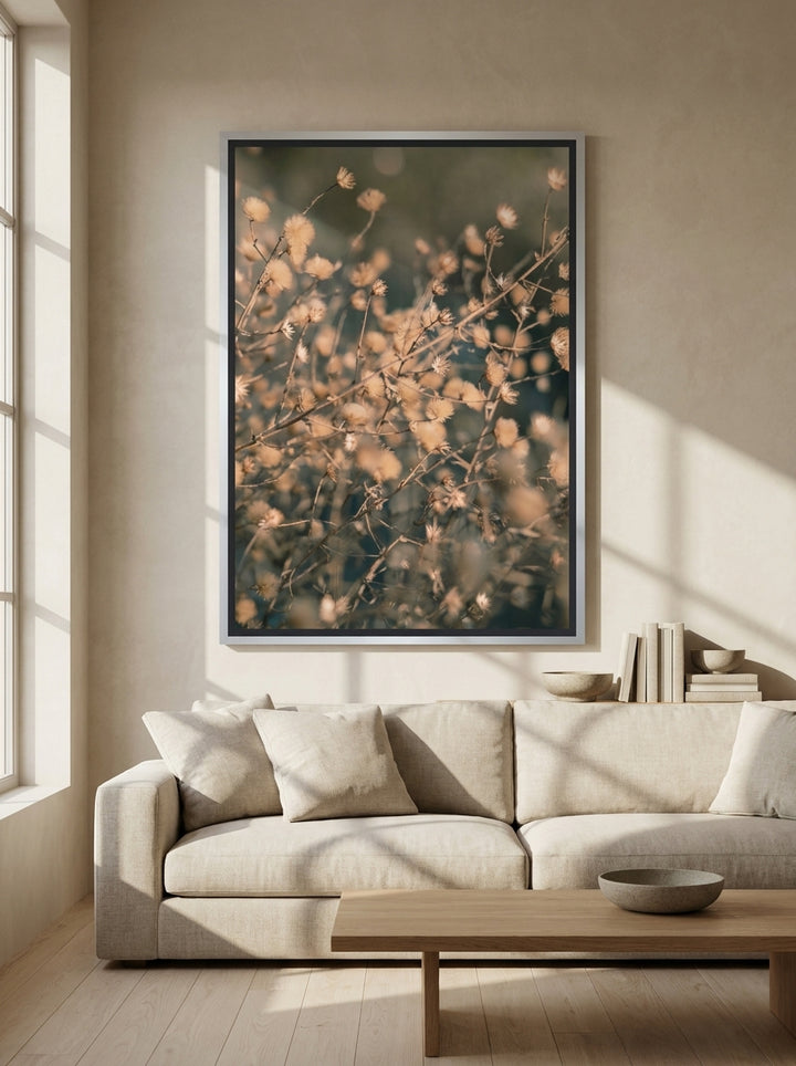 Oversized statement canvas wall art with a silver leaf surround styled on the wall in a warm Japandi living room