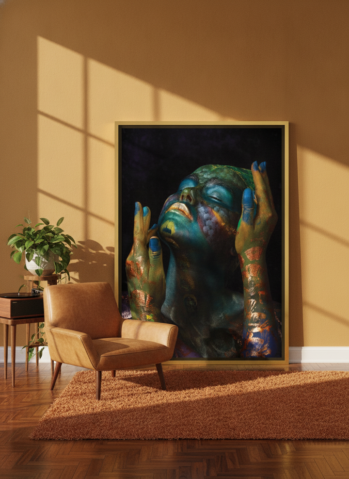 Oversized statement canvas wall art with a gold leaf surround leaning against the wall in a retro 70s living room