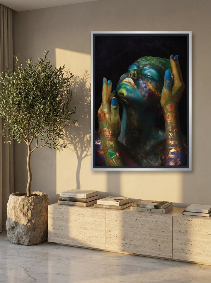 Canvas wall art with a silver leaf surround styled on the wall in a luxe living room