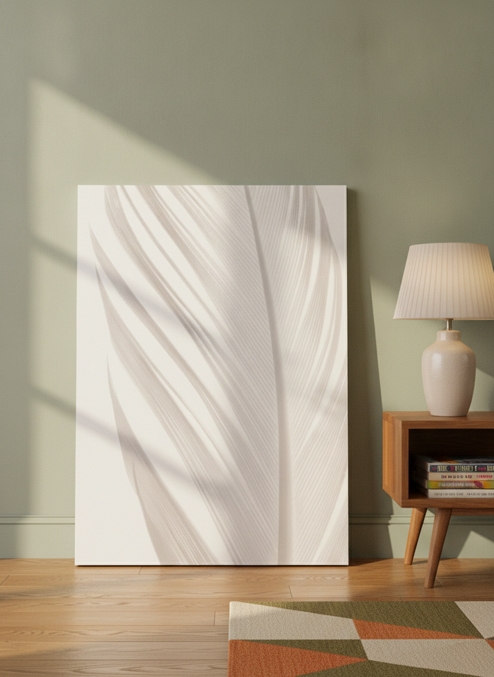 Stretched canvas wall art leaning against the wall in a mid-century living room