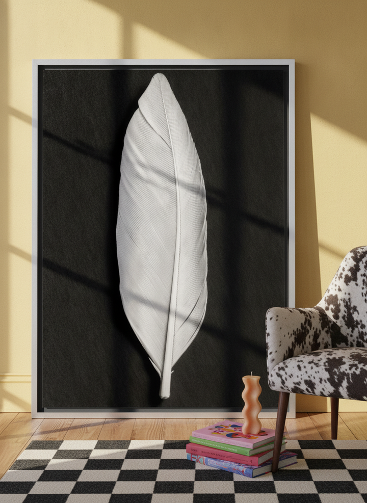 Oversized statement canvas wall art with a silver leaf surround leaning against the wall in a colourful eclectic living room