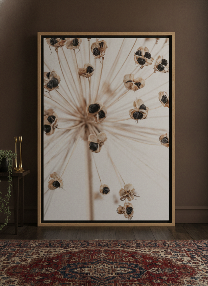 Oversized statement canvas wall art with a natural timber surround leaning against the wall in a moody home office