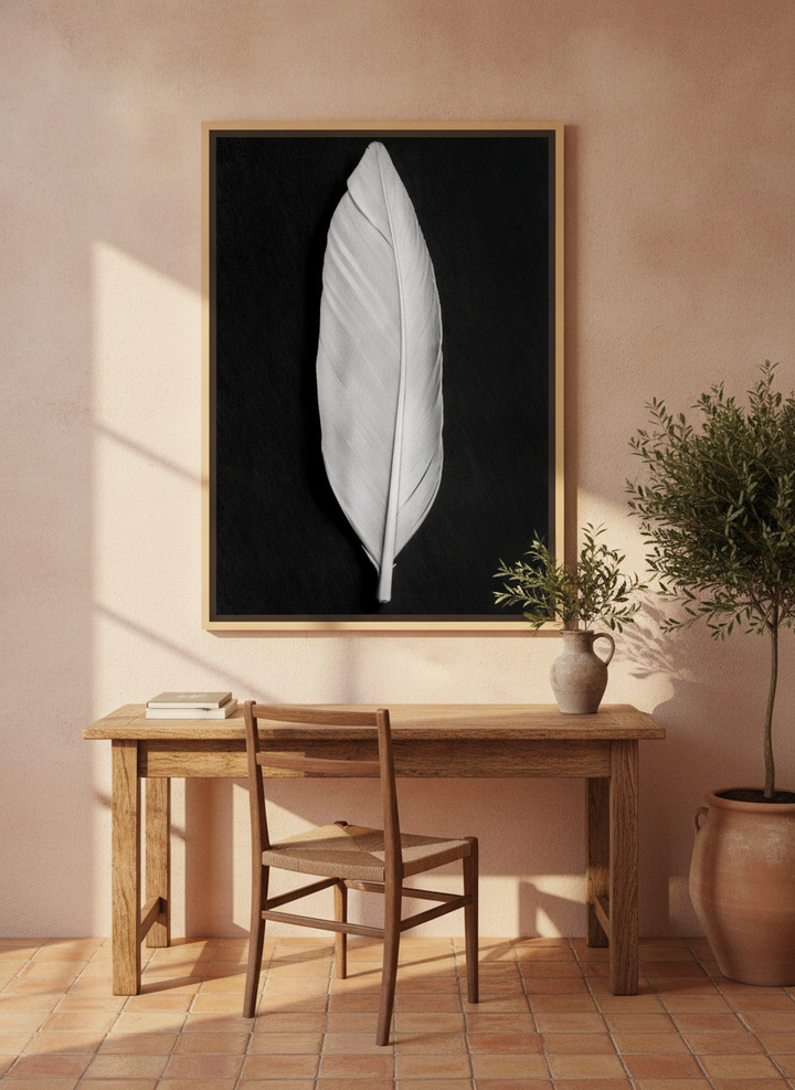 Canvas wall art with a natural timber surround styled on the wall in a Mediterranean home office