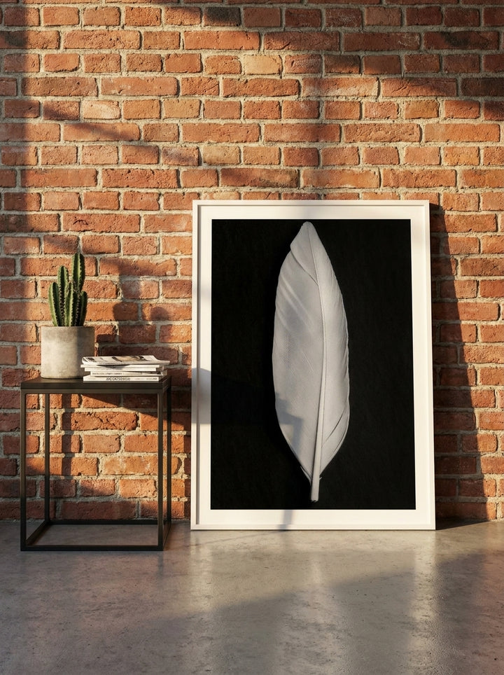 Modern wall art print leaning against the wall in an industrial loft bedroom