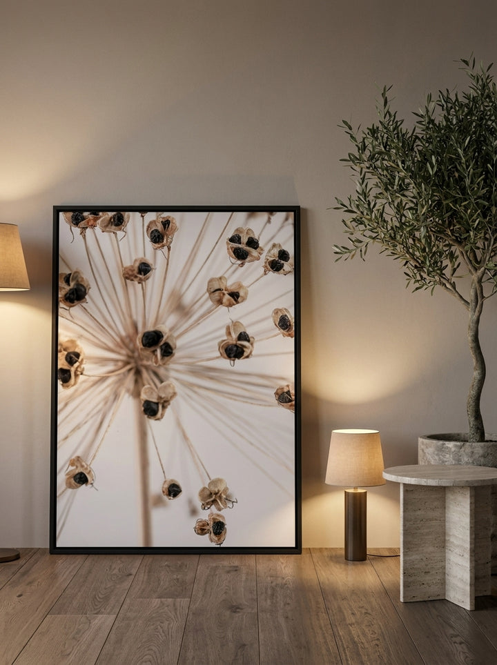 Canvas wall art with a black surround leaning against the wall in a luxe bathroom
