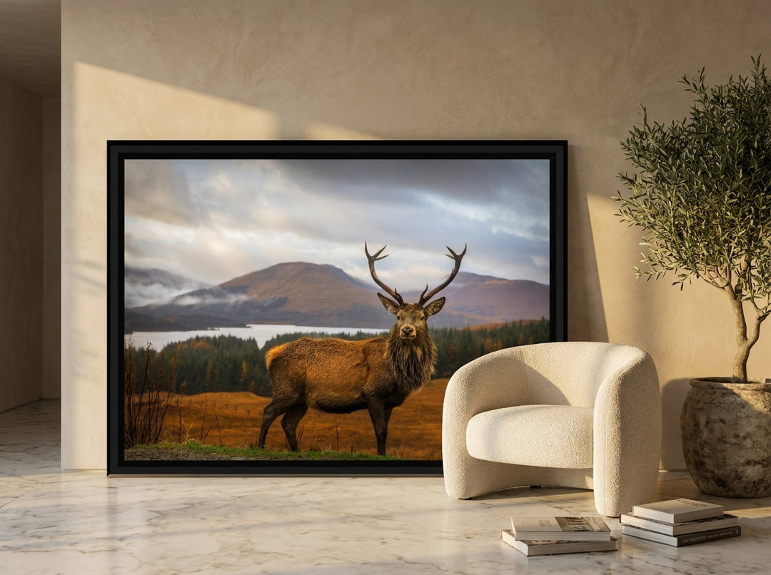 Oversized statement canvas wall art with a black surround leaning against the wall in a luxe dining room
