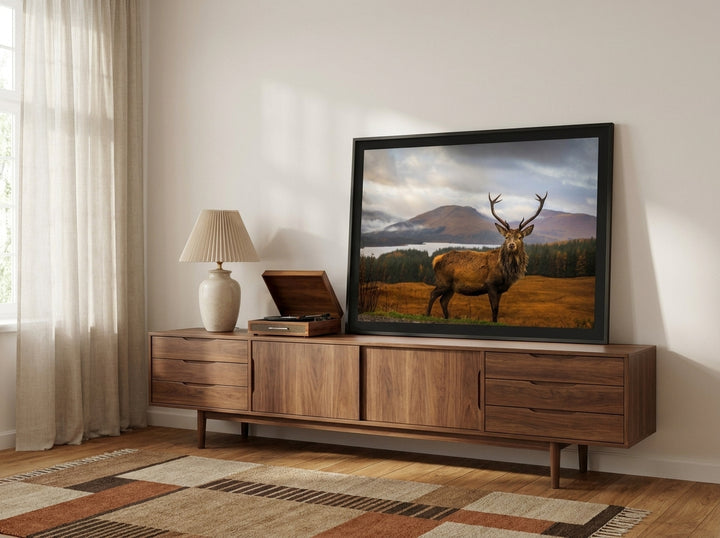 Modern wall art print standing on a sideboard in a mid-century home office