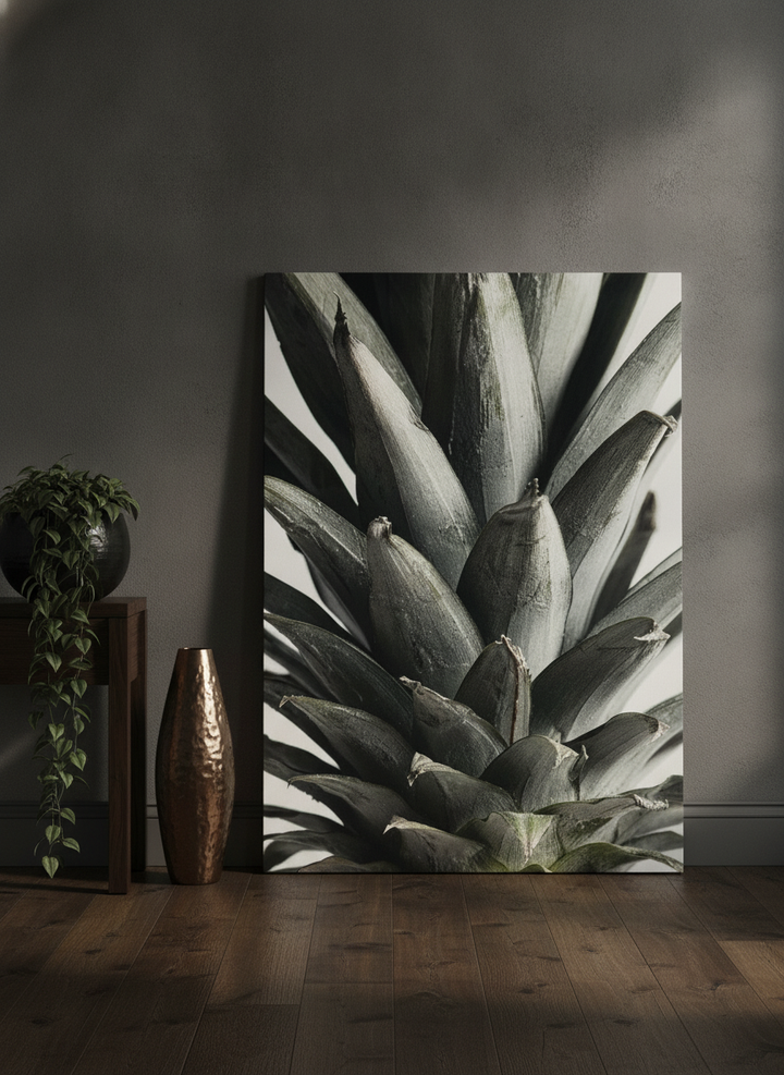 Stretched canvas wall art leaning against the wall in a moody dining room