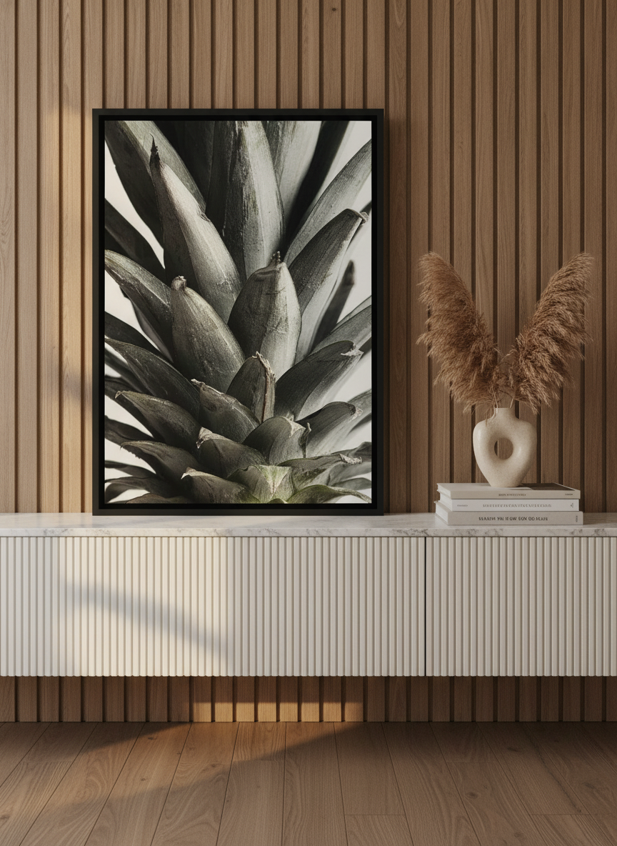 Canvas wall art with a black surround standing on a sideboard in a luxe bathroom