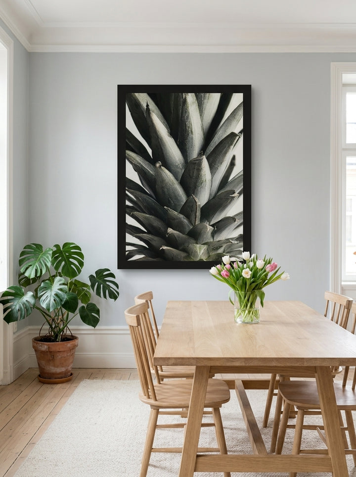 Oversized statement modern wall art print styled on the wall in a bright Scandinavian dining room